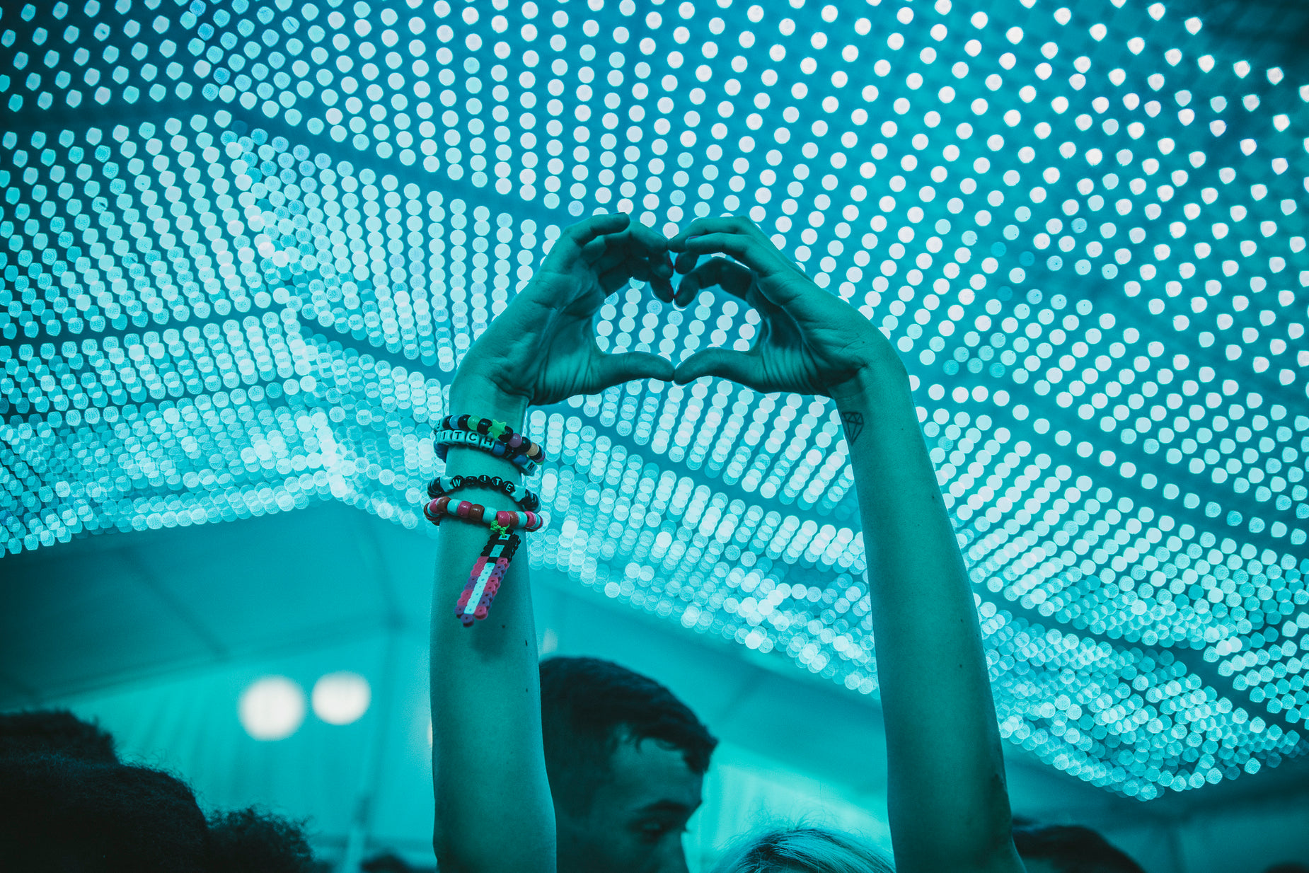 a couple making heart shaped with their hands