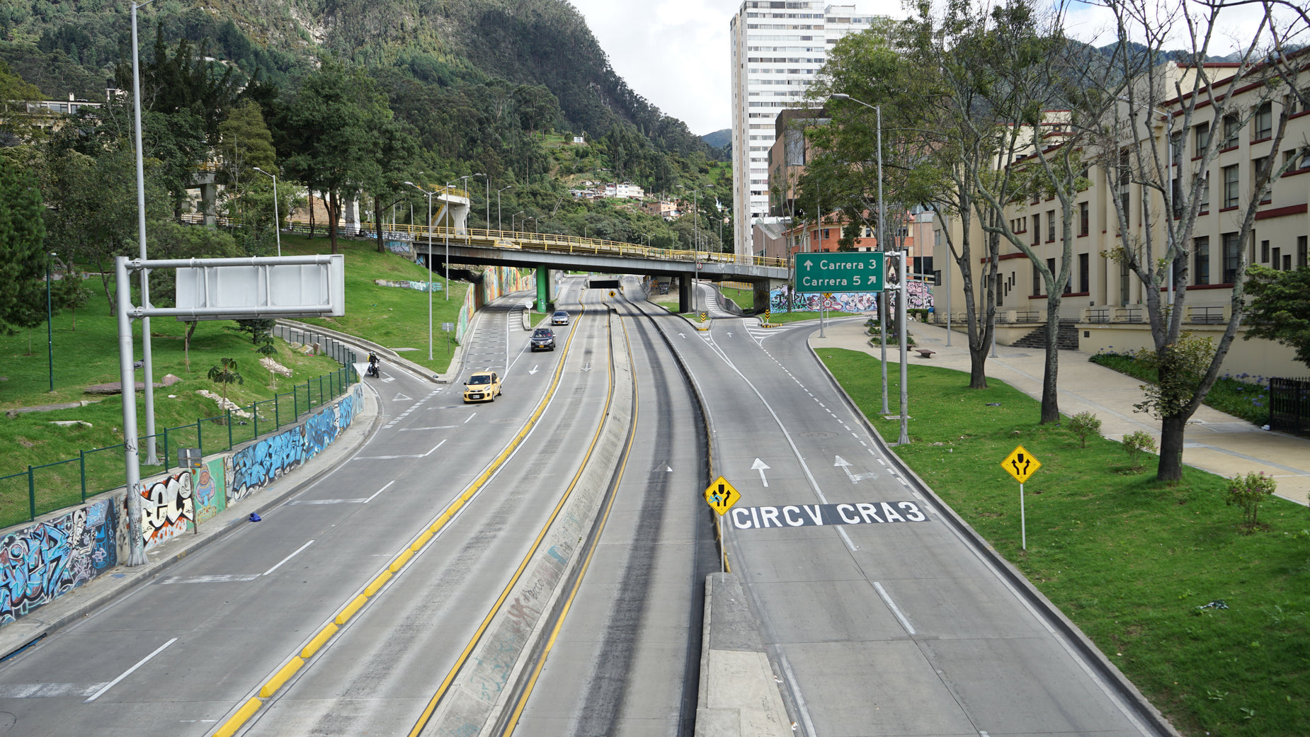 the road near this city intersection is empty