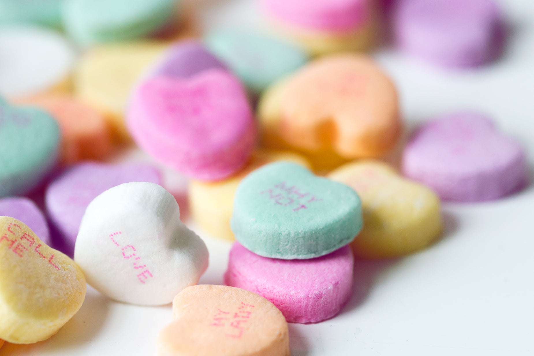 hearts made with various candy colors are grouped together