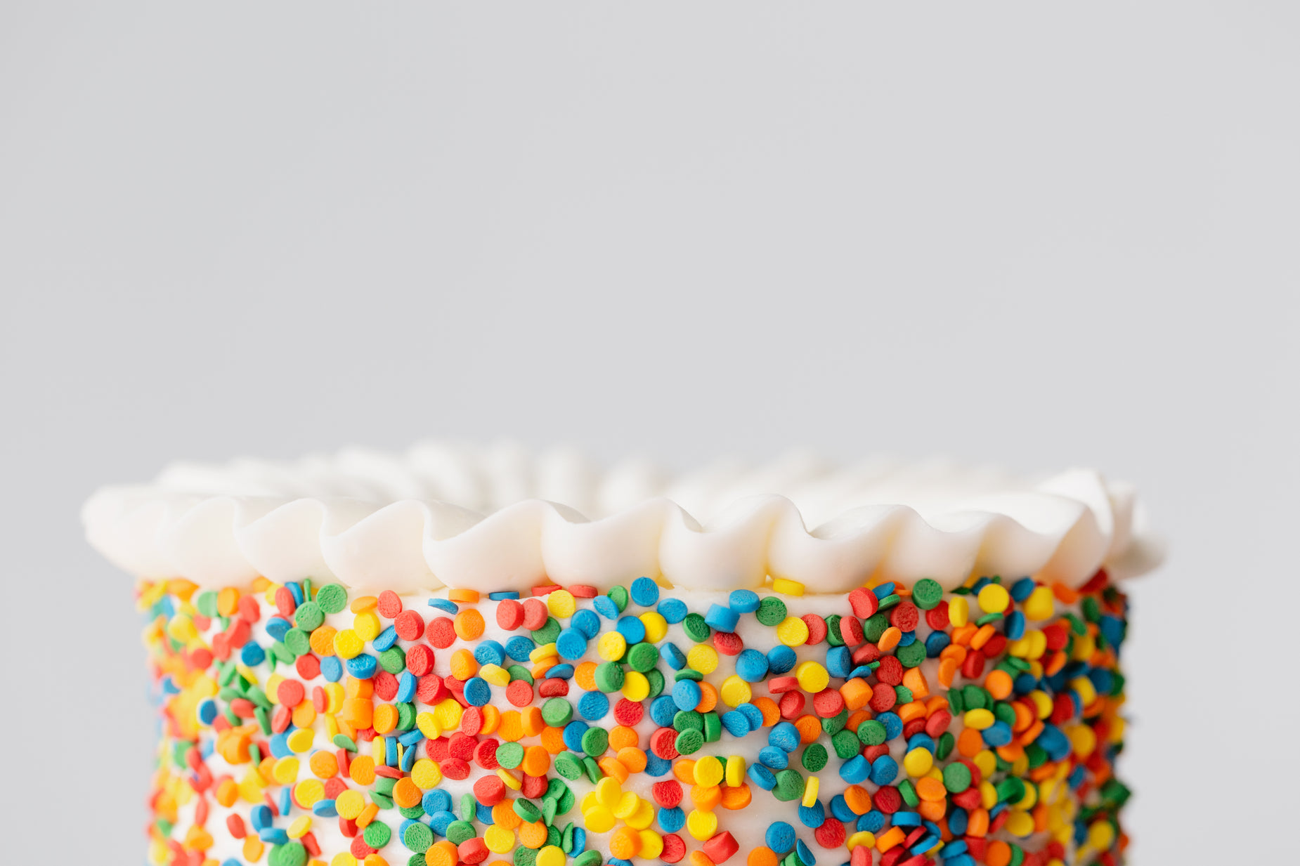a close up of a cake with sprinkles on it