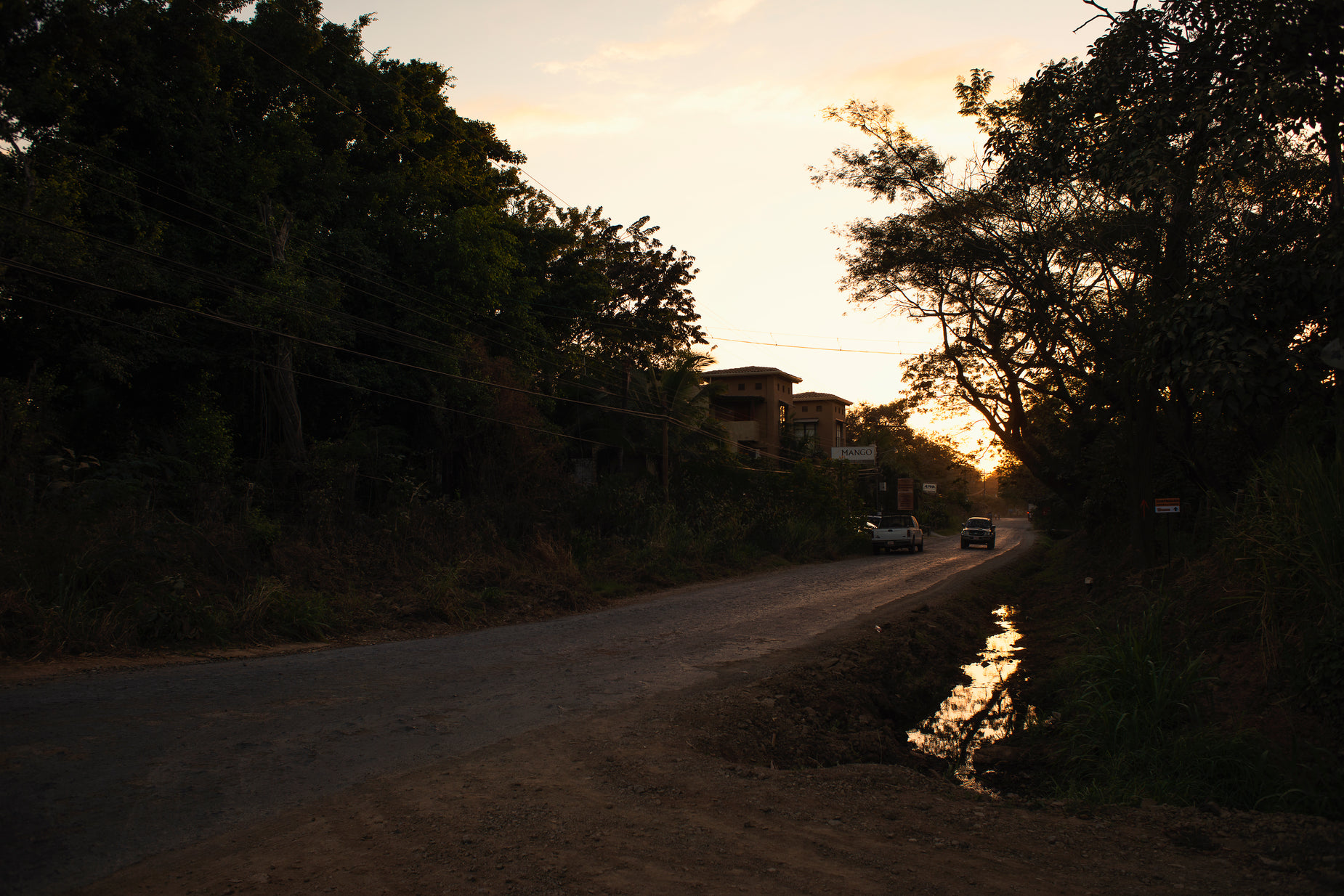 a vehicle that is parked along side a road