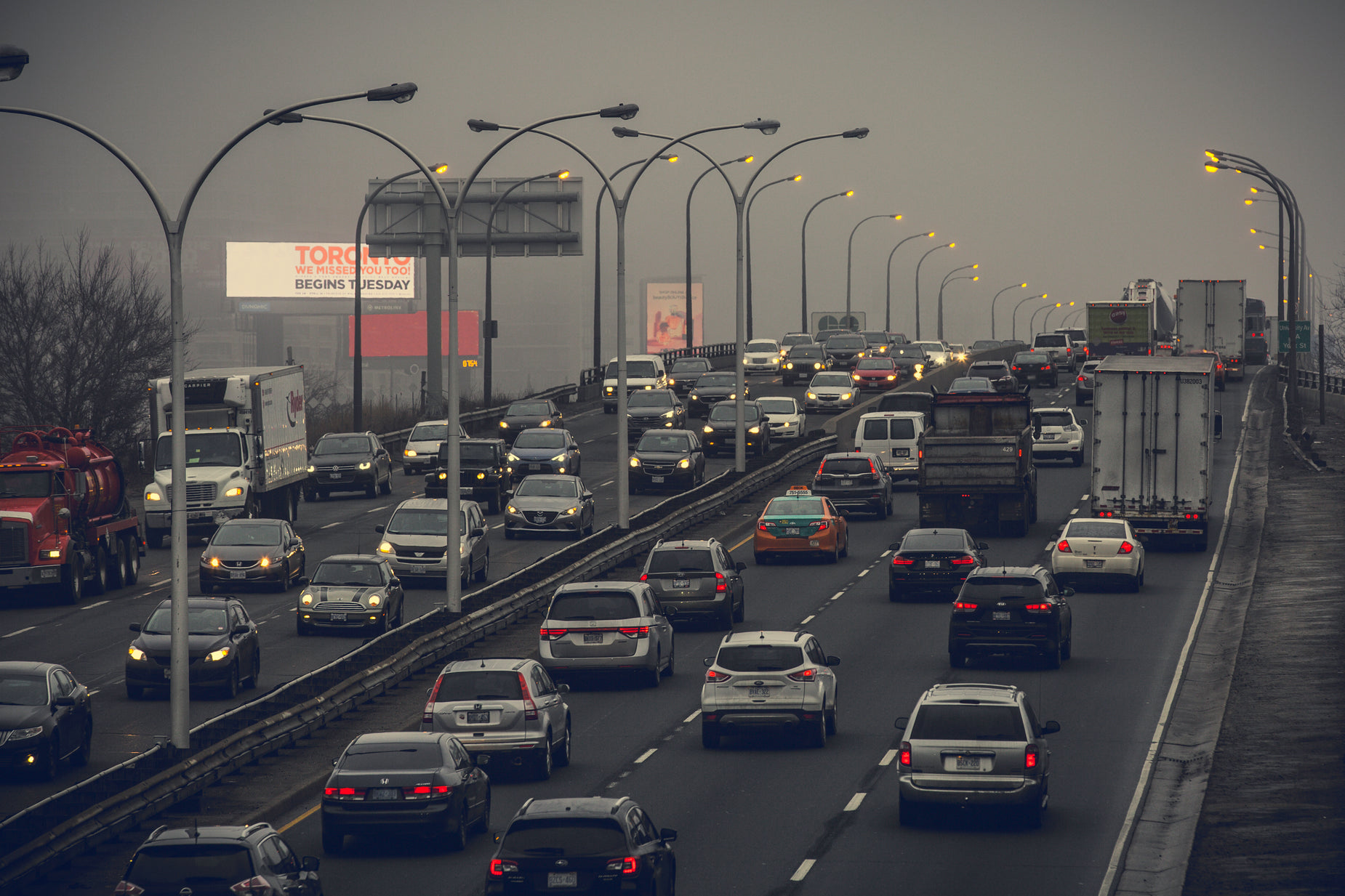 a large group of cars travel down the highway