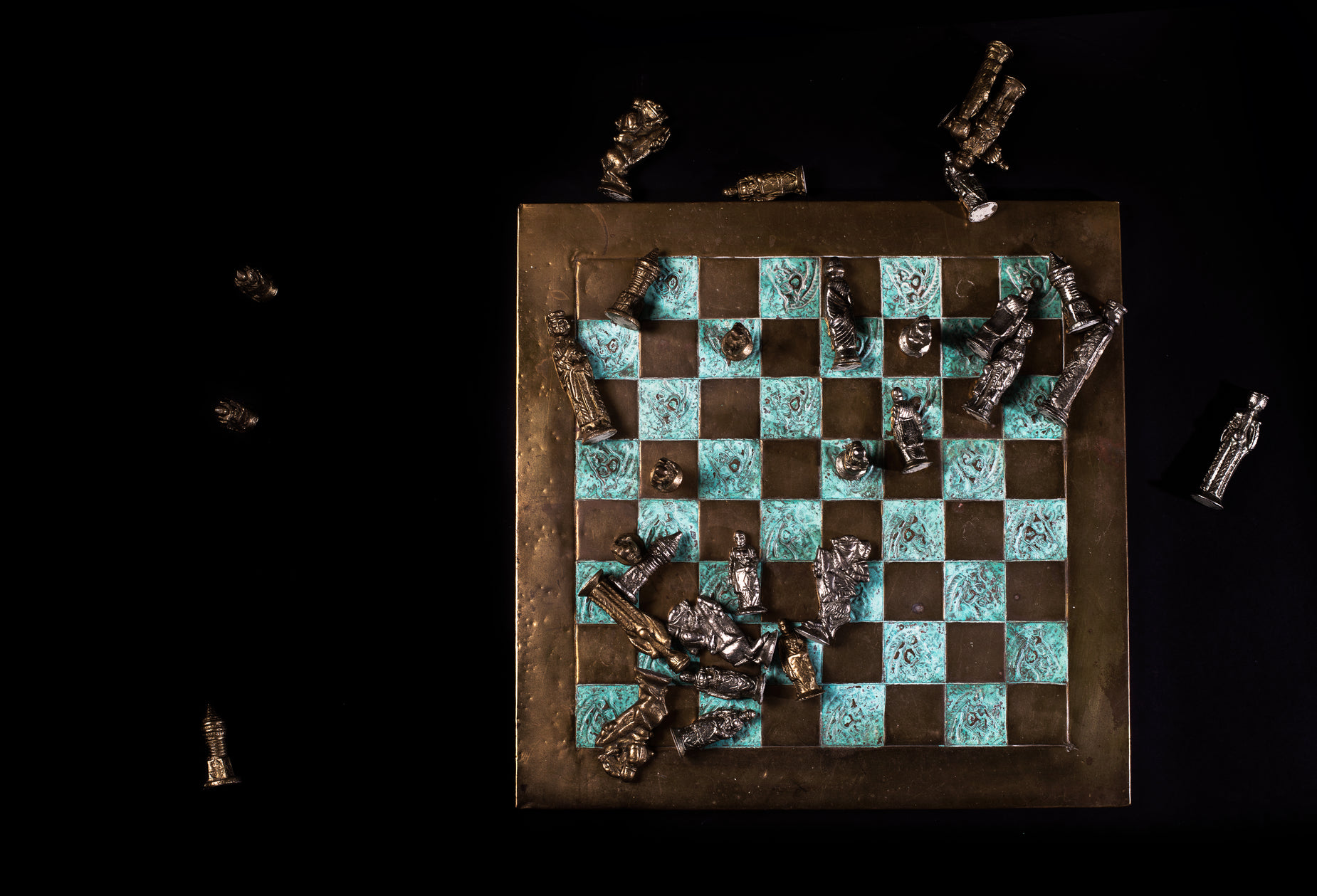 a close up of a chess board with lots of small objects on it