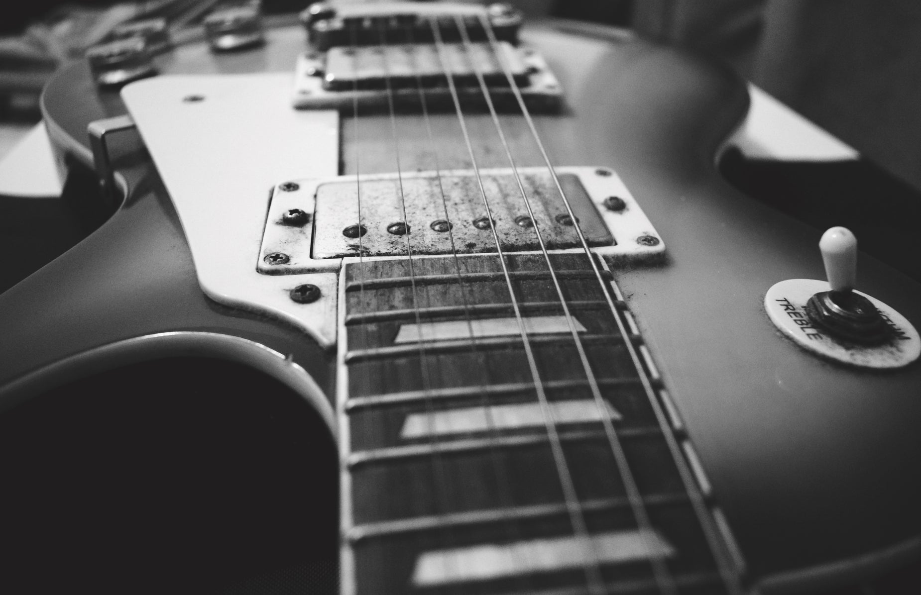 a black and white po of an electric guitar