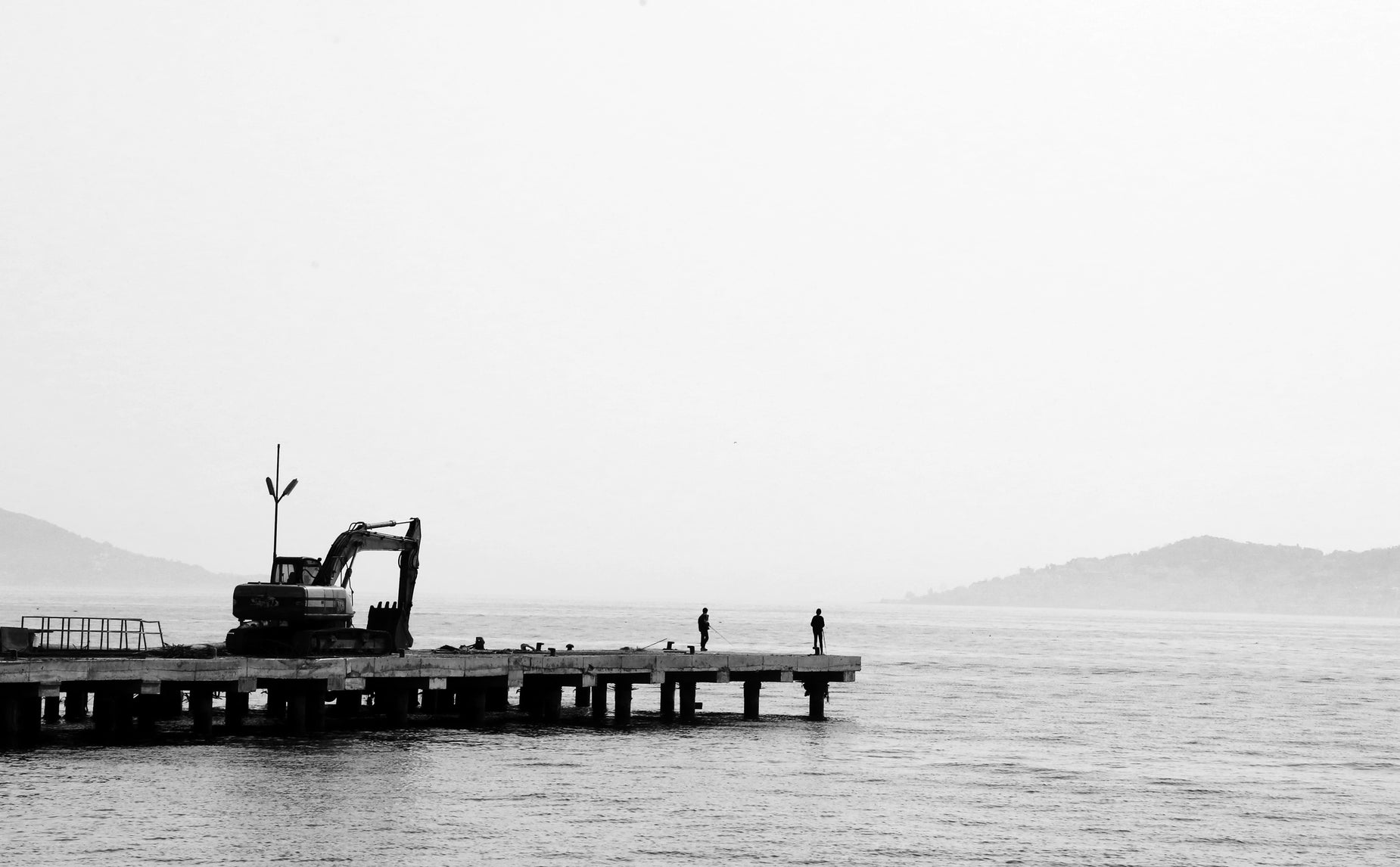 a boat sitting on a wooden pier during the day