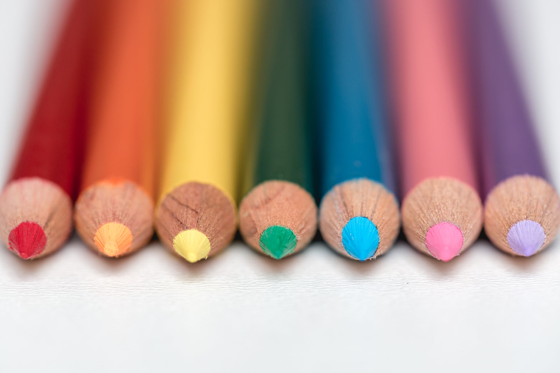 a close up of a group of colorful pencils