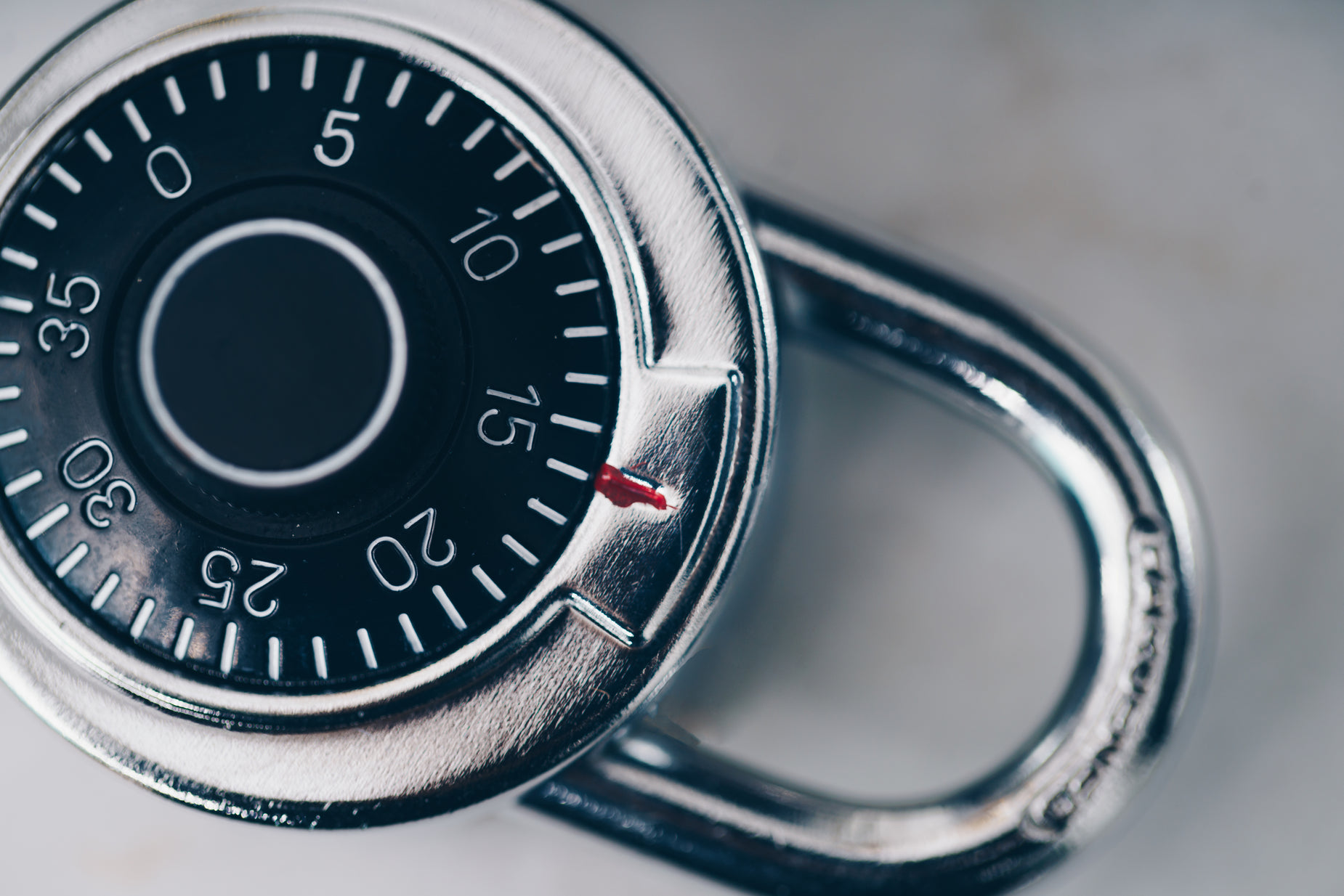 a combination combination lock on a white surface