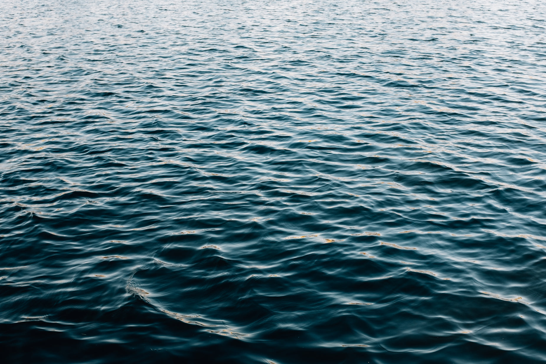 an ocean view, with one boat in the distance