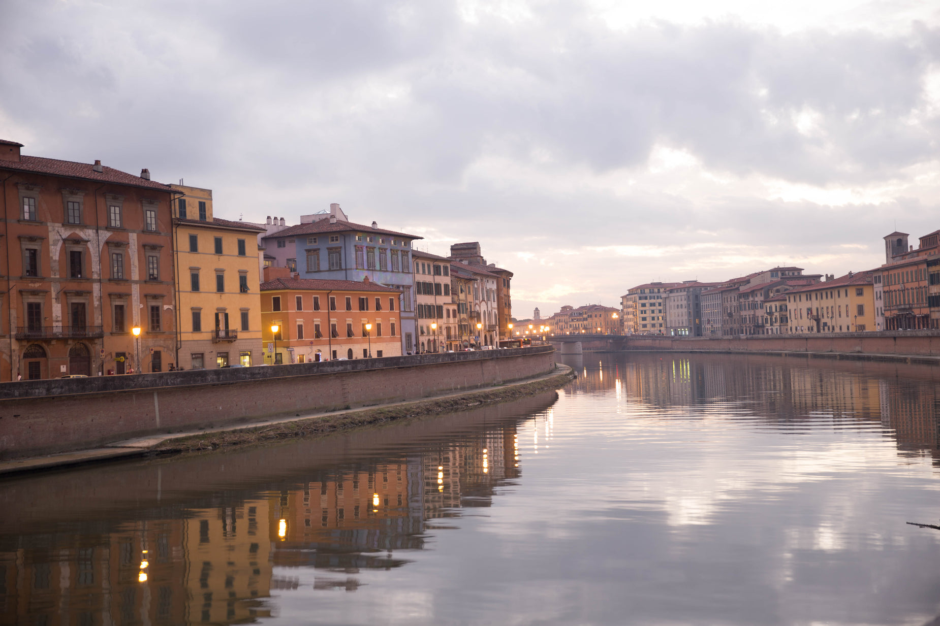 a river with buildings along side and water