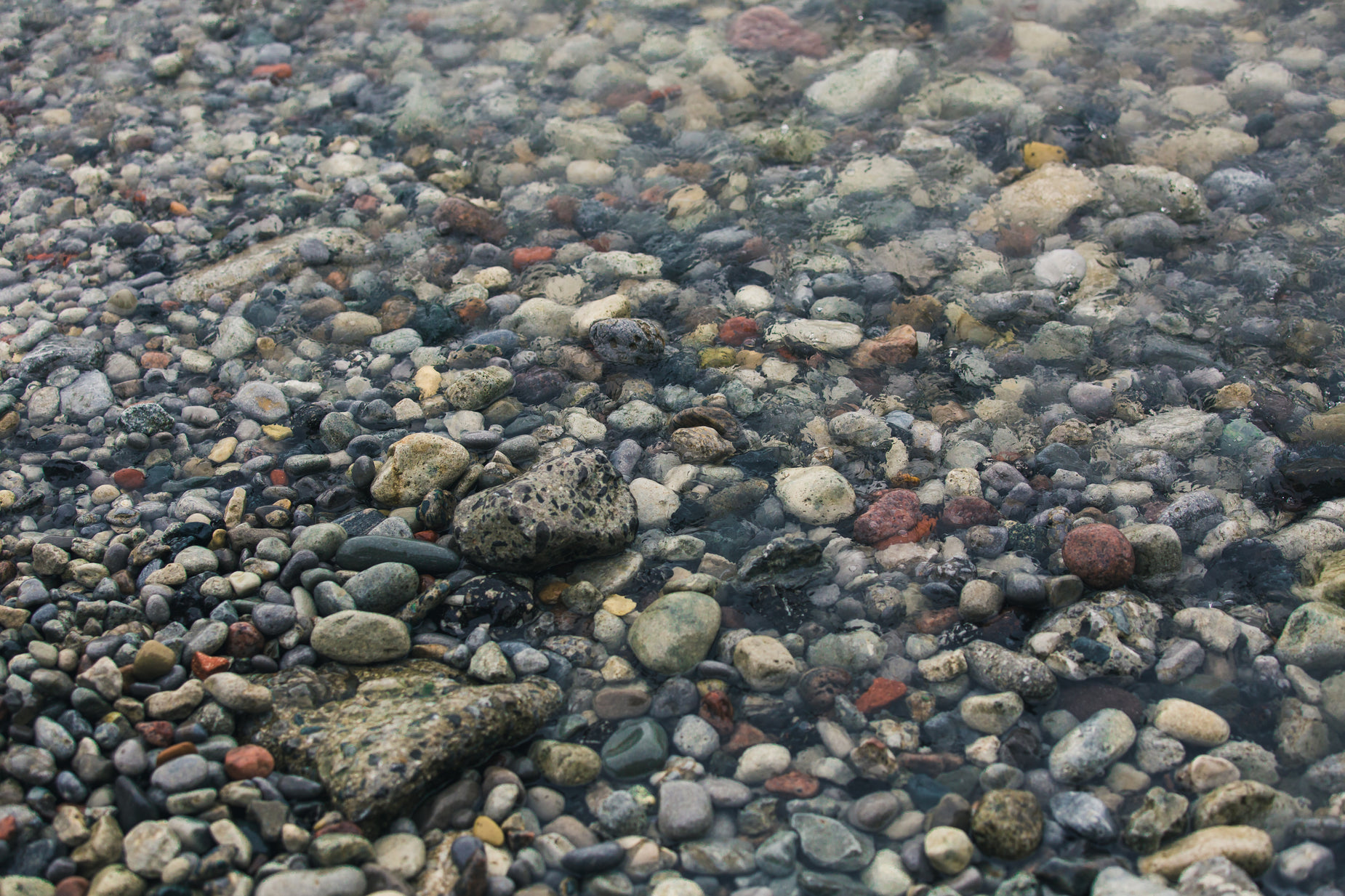 the rocks and pebbles are all that have been thrown in the water