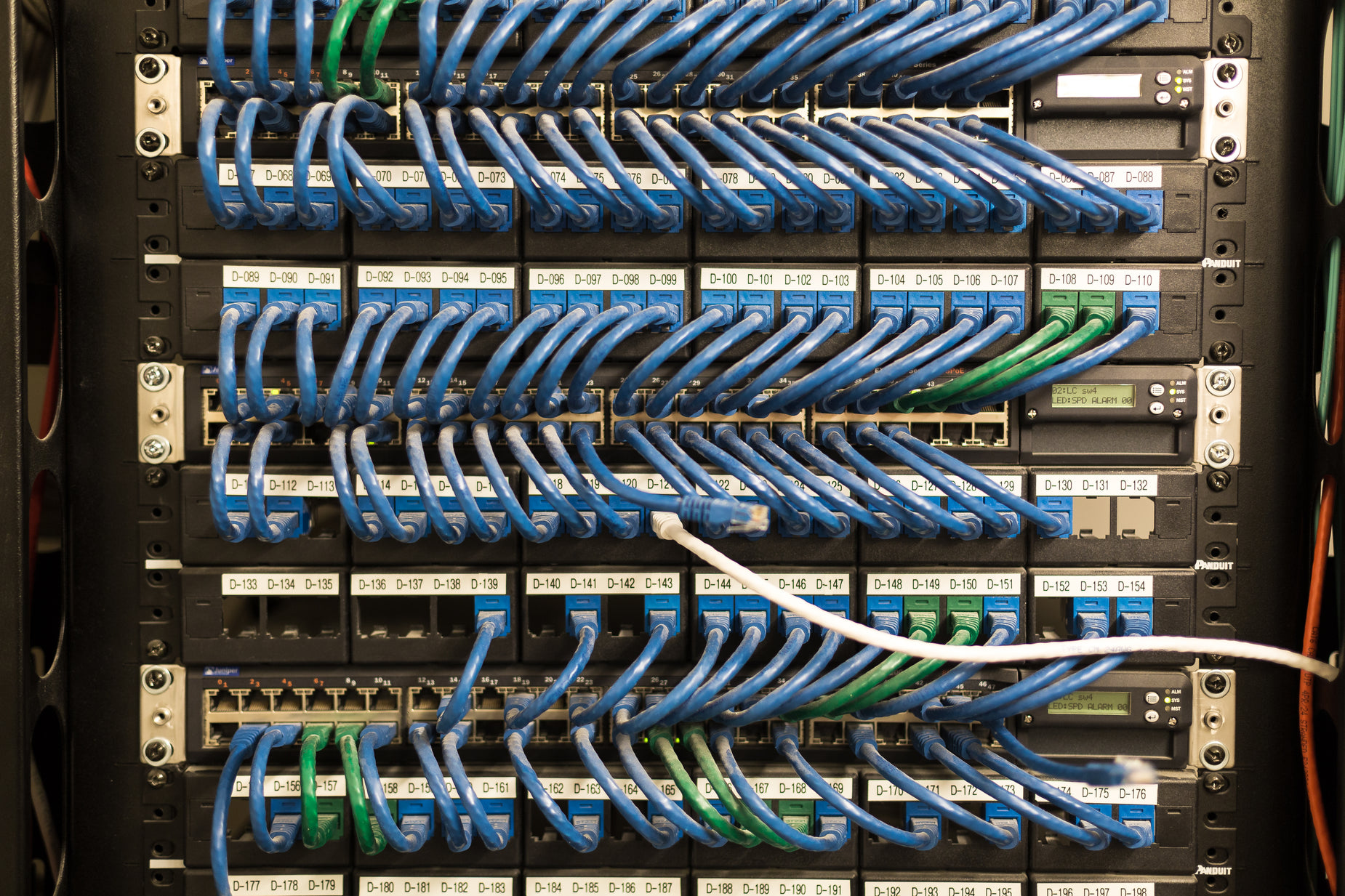 several servers are connected together with colorful cables