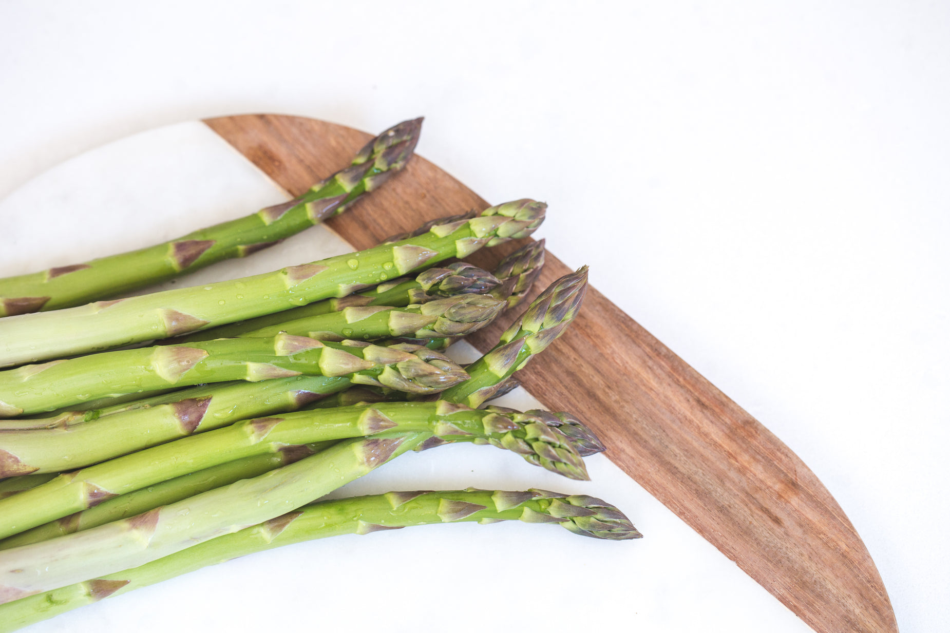 there are some asparagus that are sitting on a board