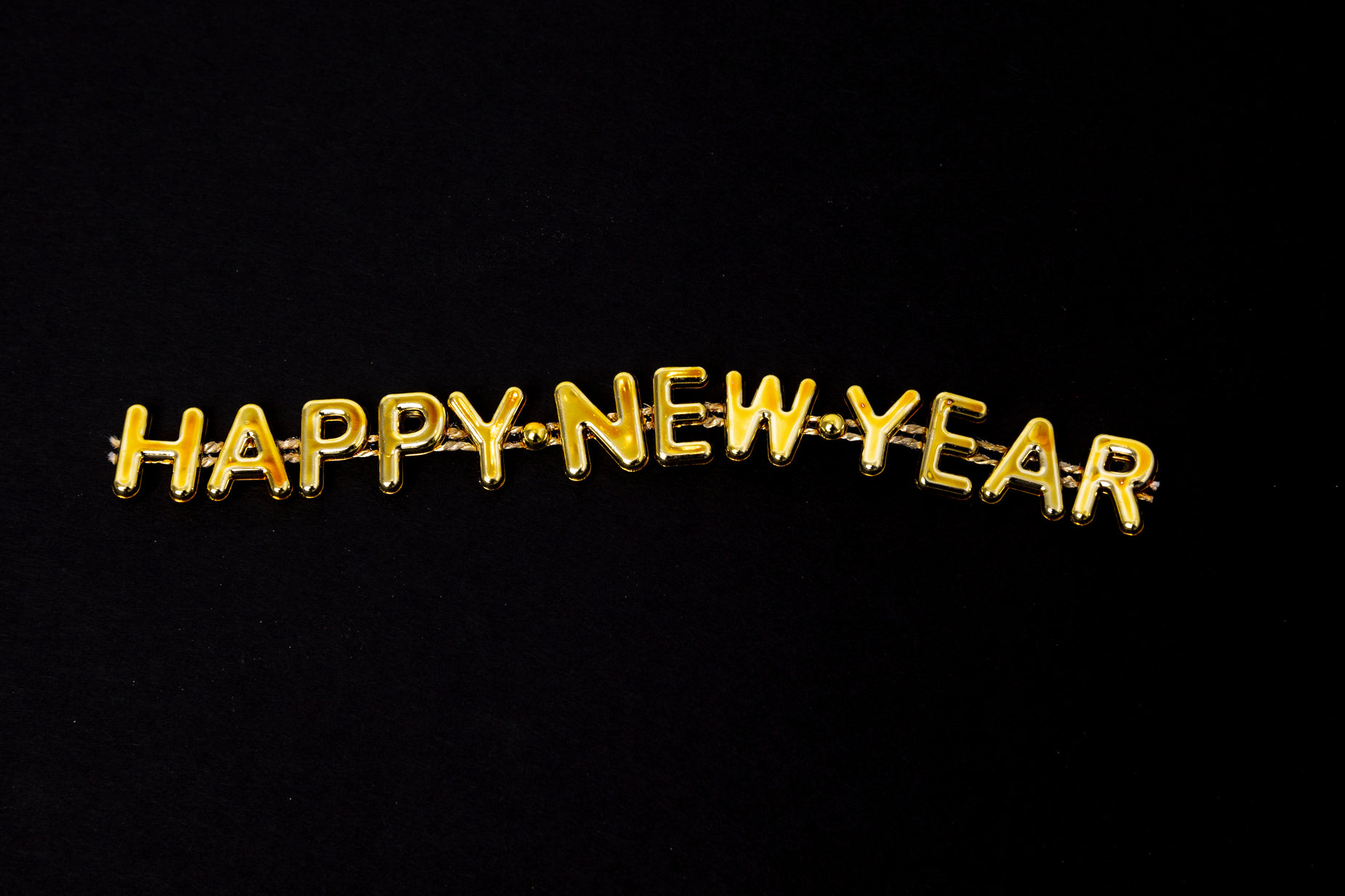 a happy new year message against a dark background
