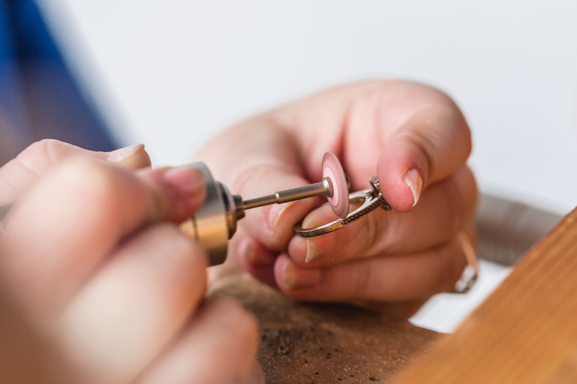 the woman is peeling the lock on her watch