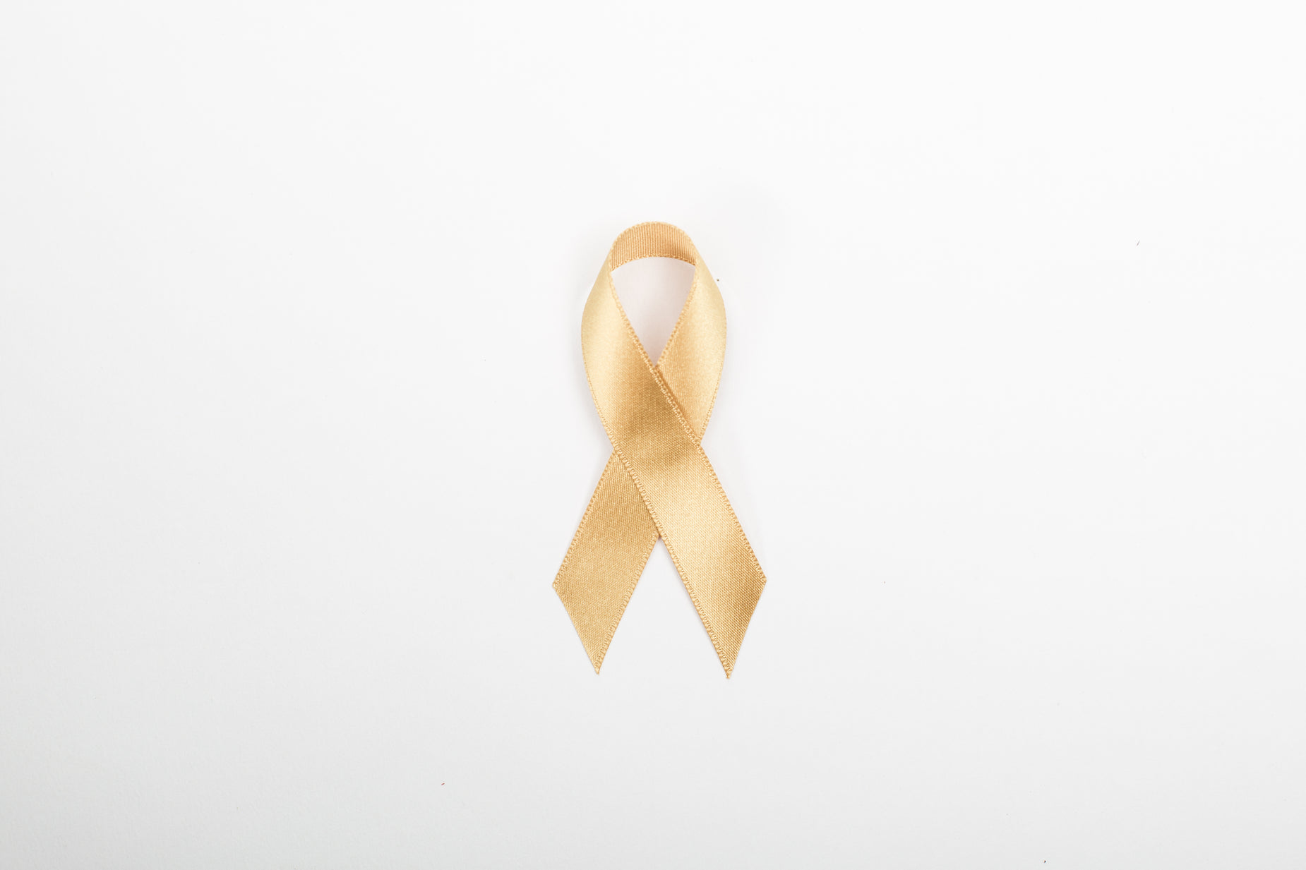 a close up of a wooden ribbon on white background