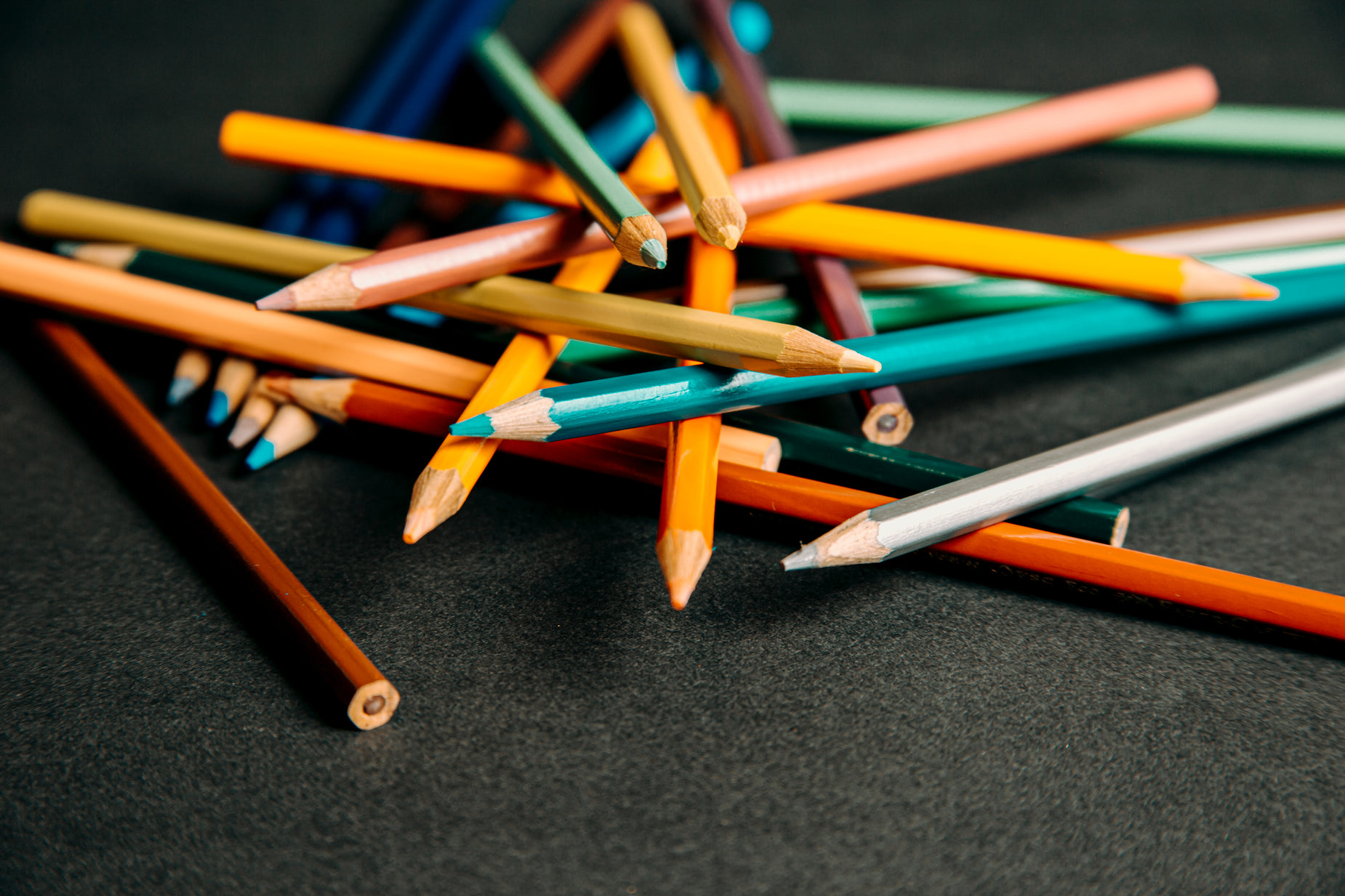 several pencils of varying sizes are shown in color