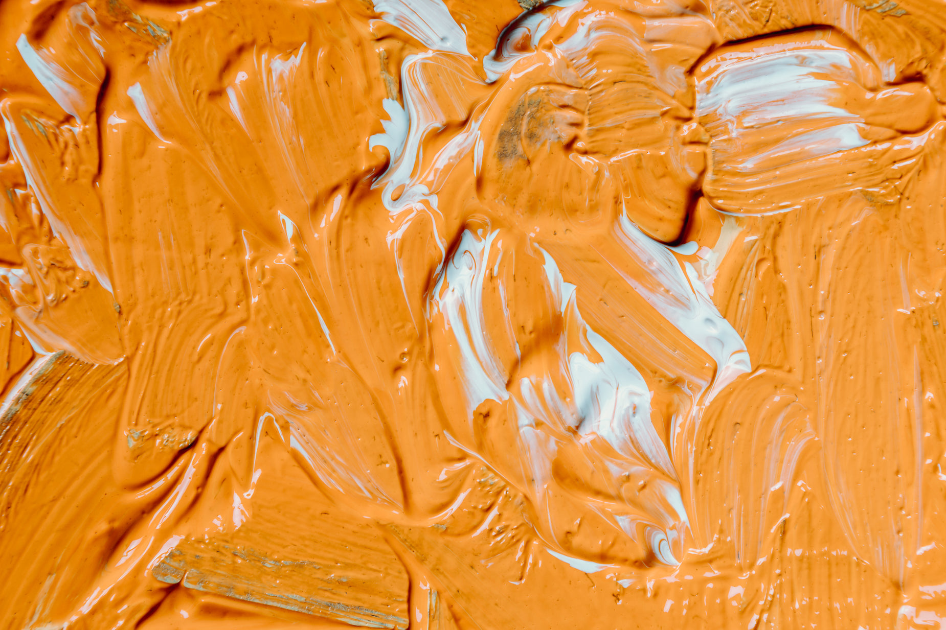 a close up view of the paint smeared with orange