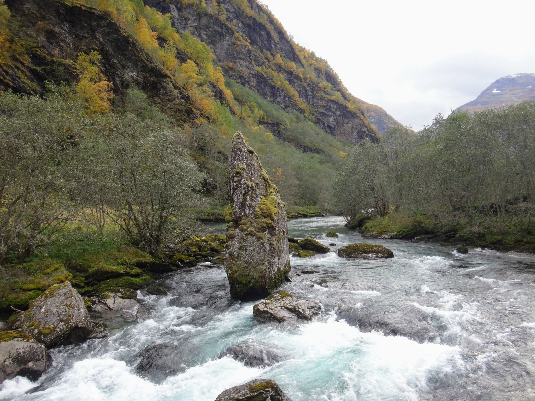 river flowing down a steep, rocky riverbank