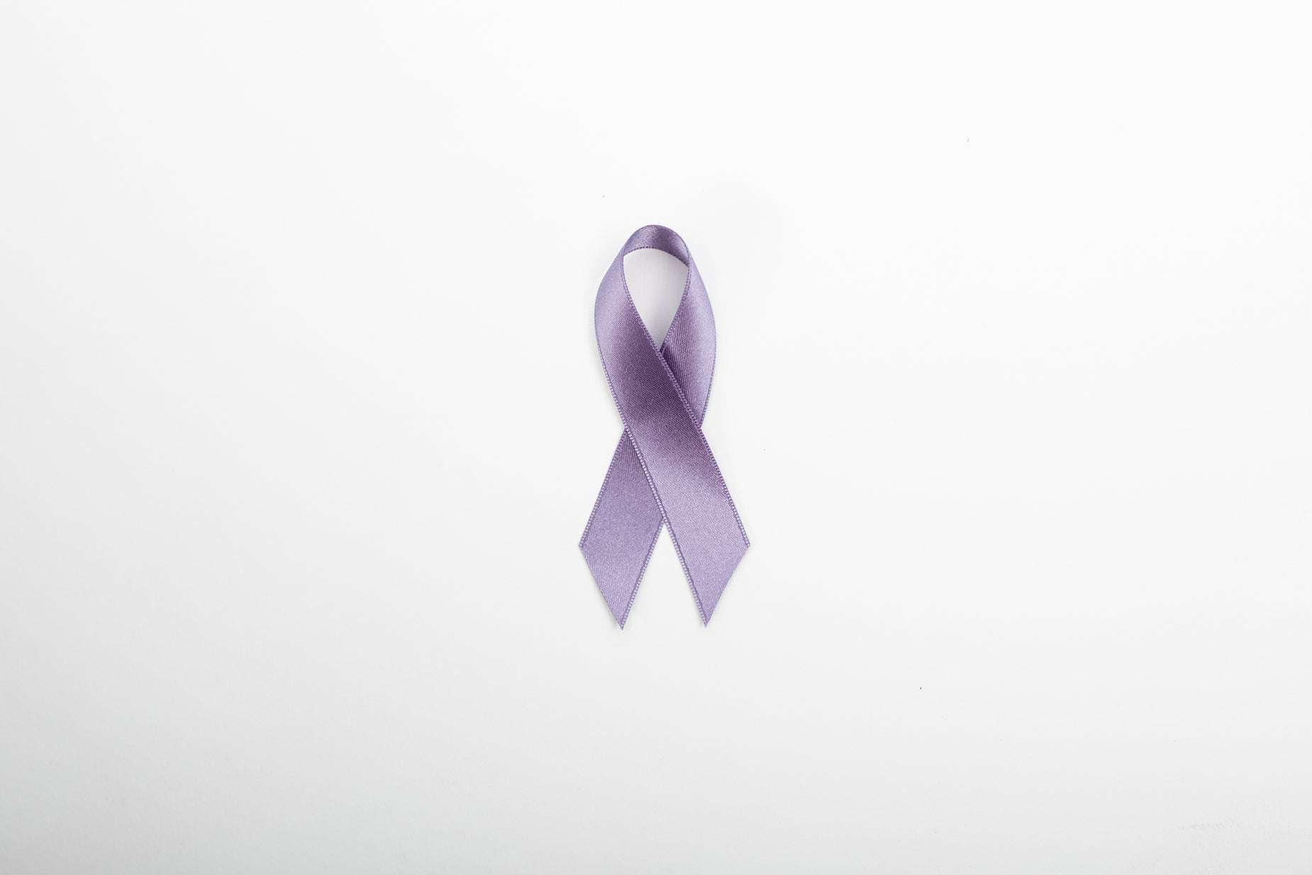 an image of a purple ribbon hanging off of a wall