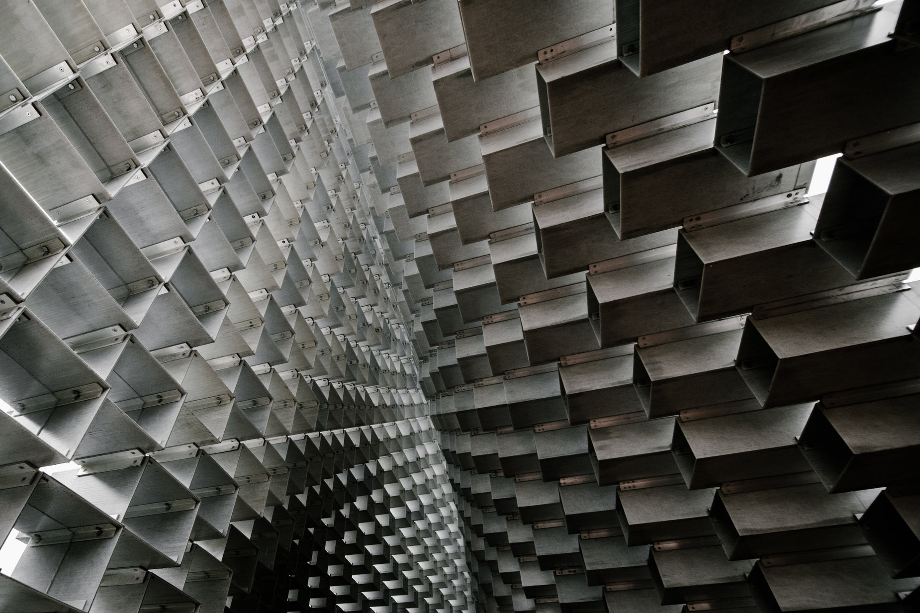 an unusual and abstract ceiling made up of multiple square pieces