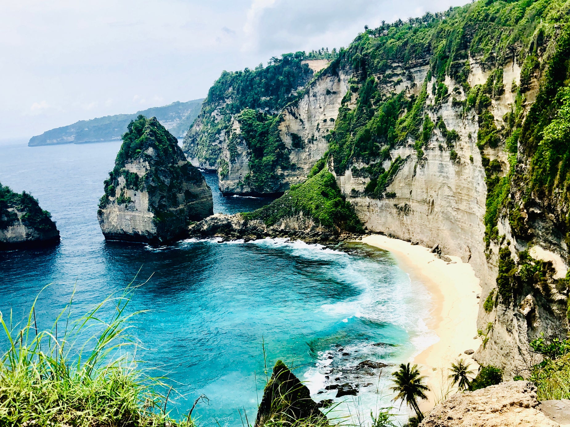 some big rock formations by the ocean