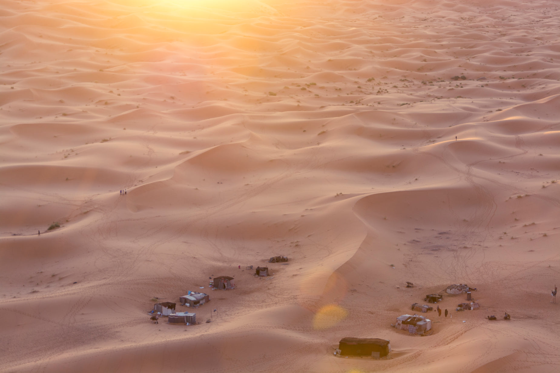 an aerial po taken on an airplane with sand dunes and farmyards