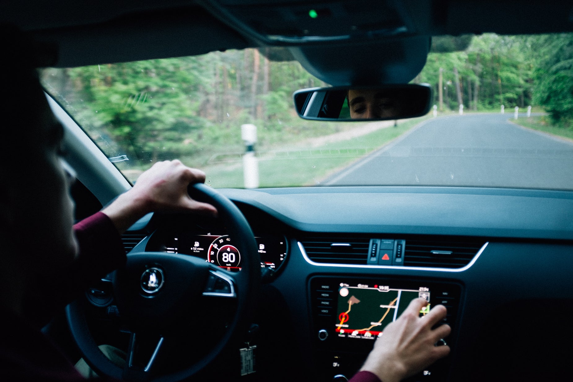 a person is riding in the passenger seat with a vehicle