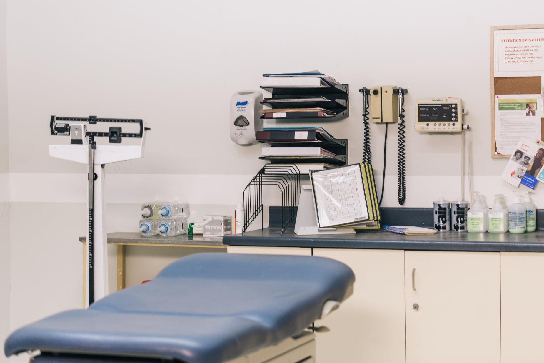 a medical office area with a table and a phone