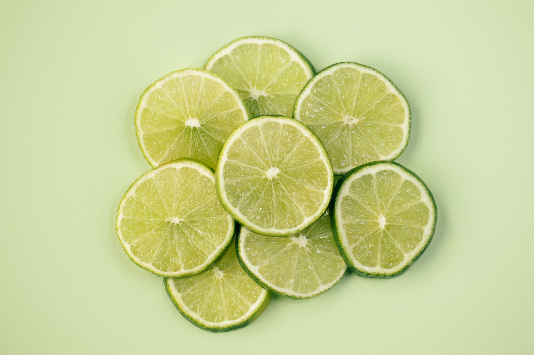 five lime halves arranged on top of each other
