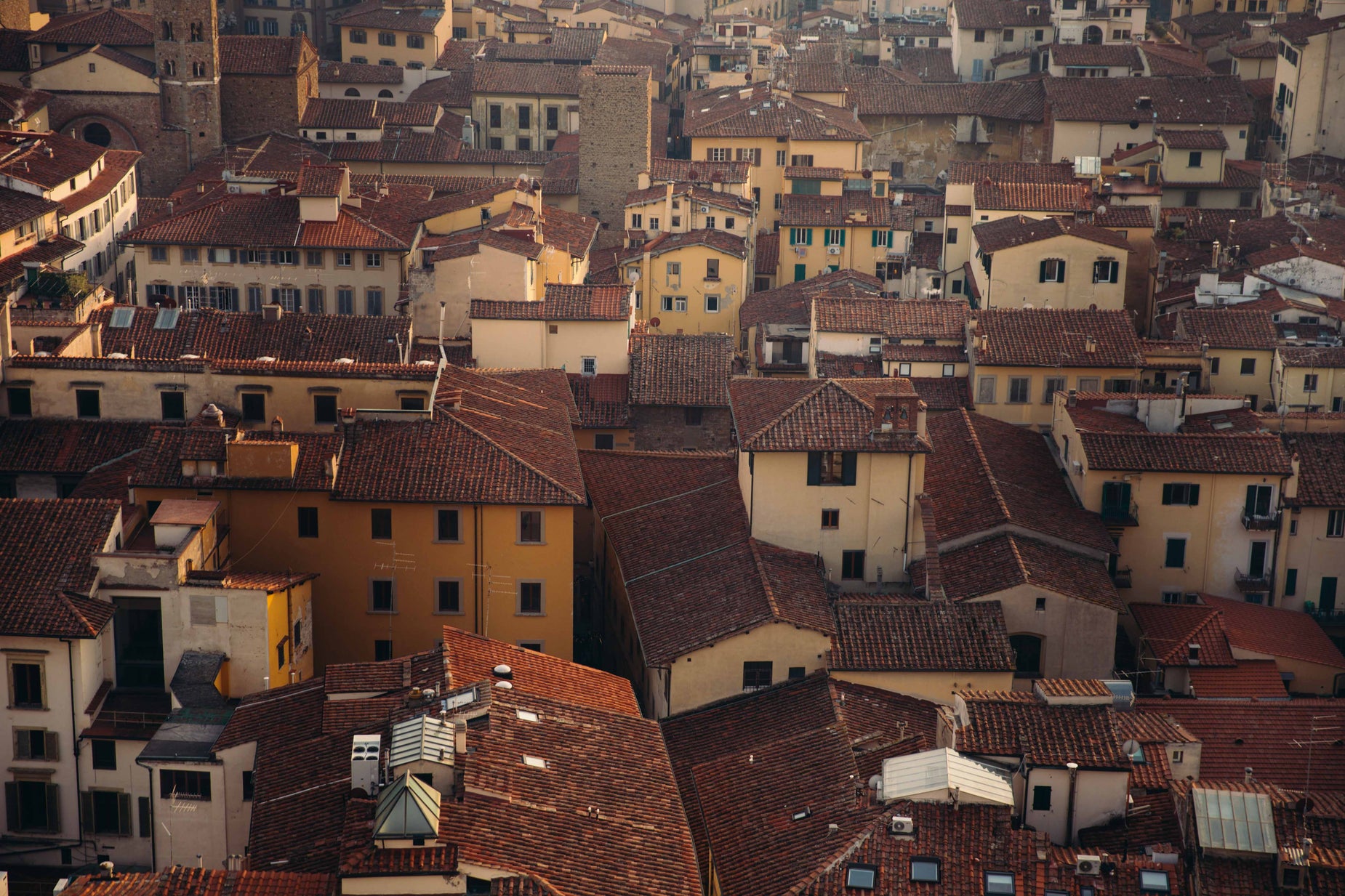 roofs are filled with yellow and red buildings