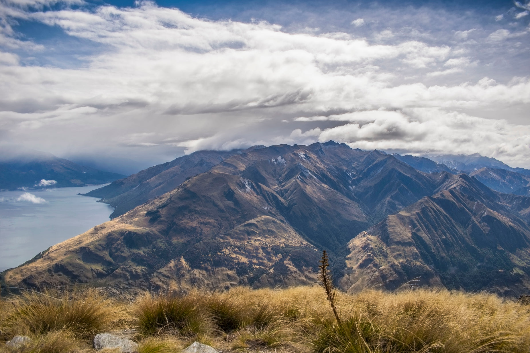 an out of focus view of the mountains and a lake