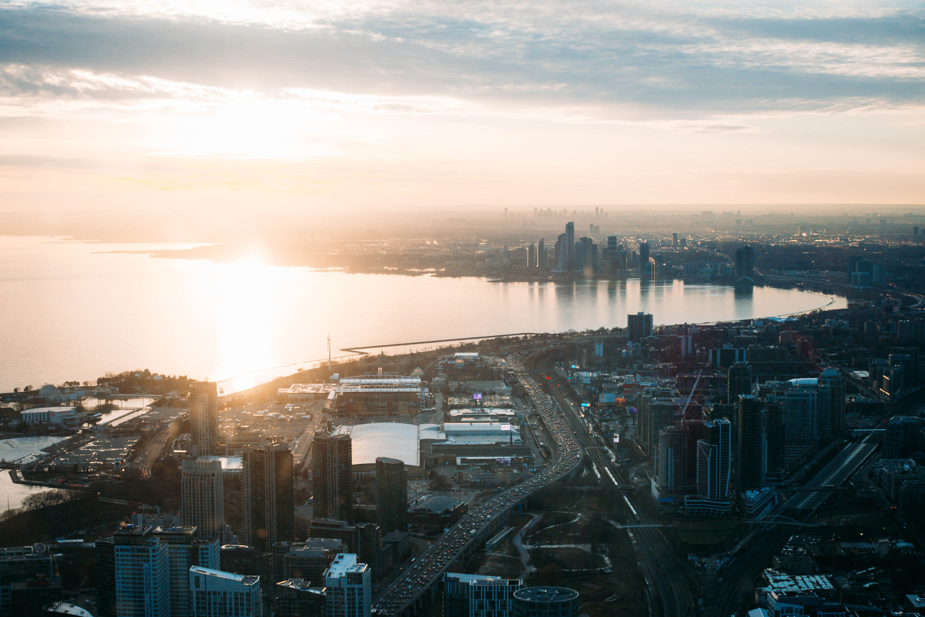 cityscape overlooking the water at sunset