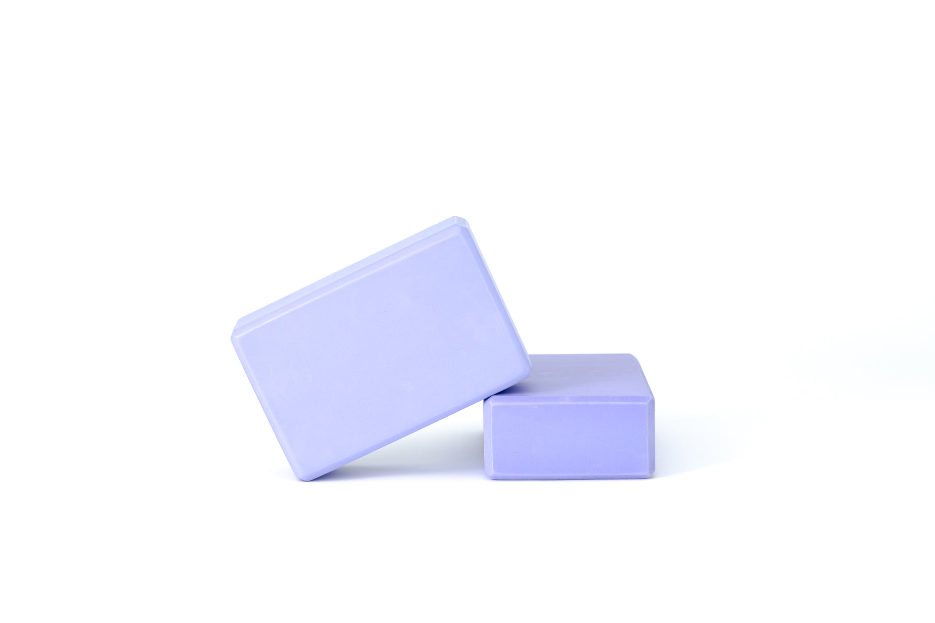a small purple block sitting next to a smaller white block