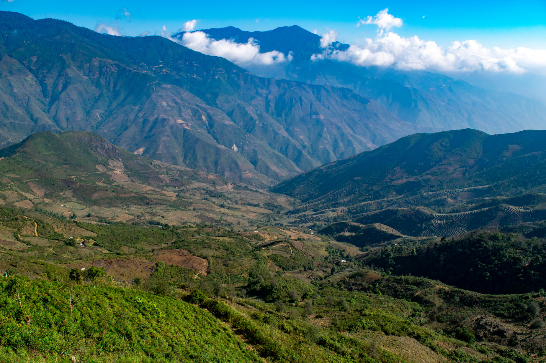 the mountains are covered with green vegetation