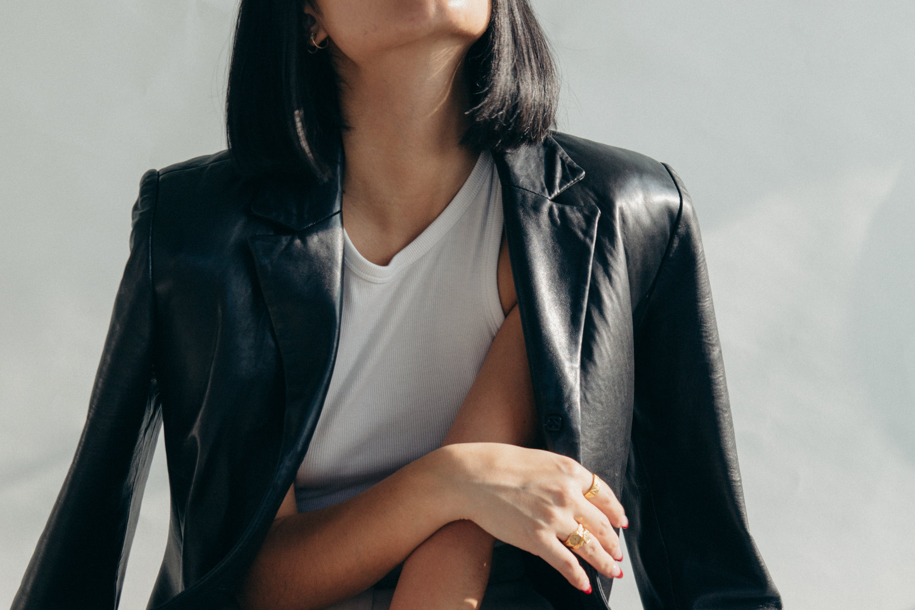 a woman with black hair is sitting down