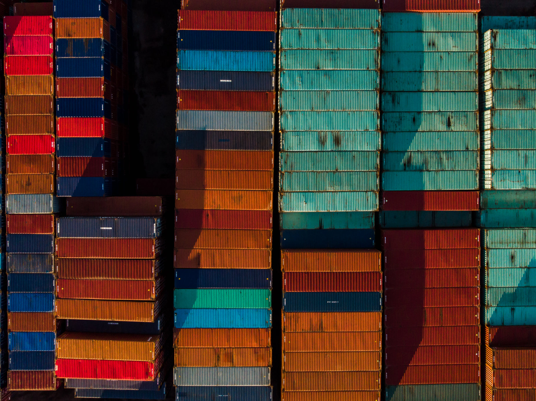 some containers sit side by side on the ground