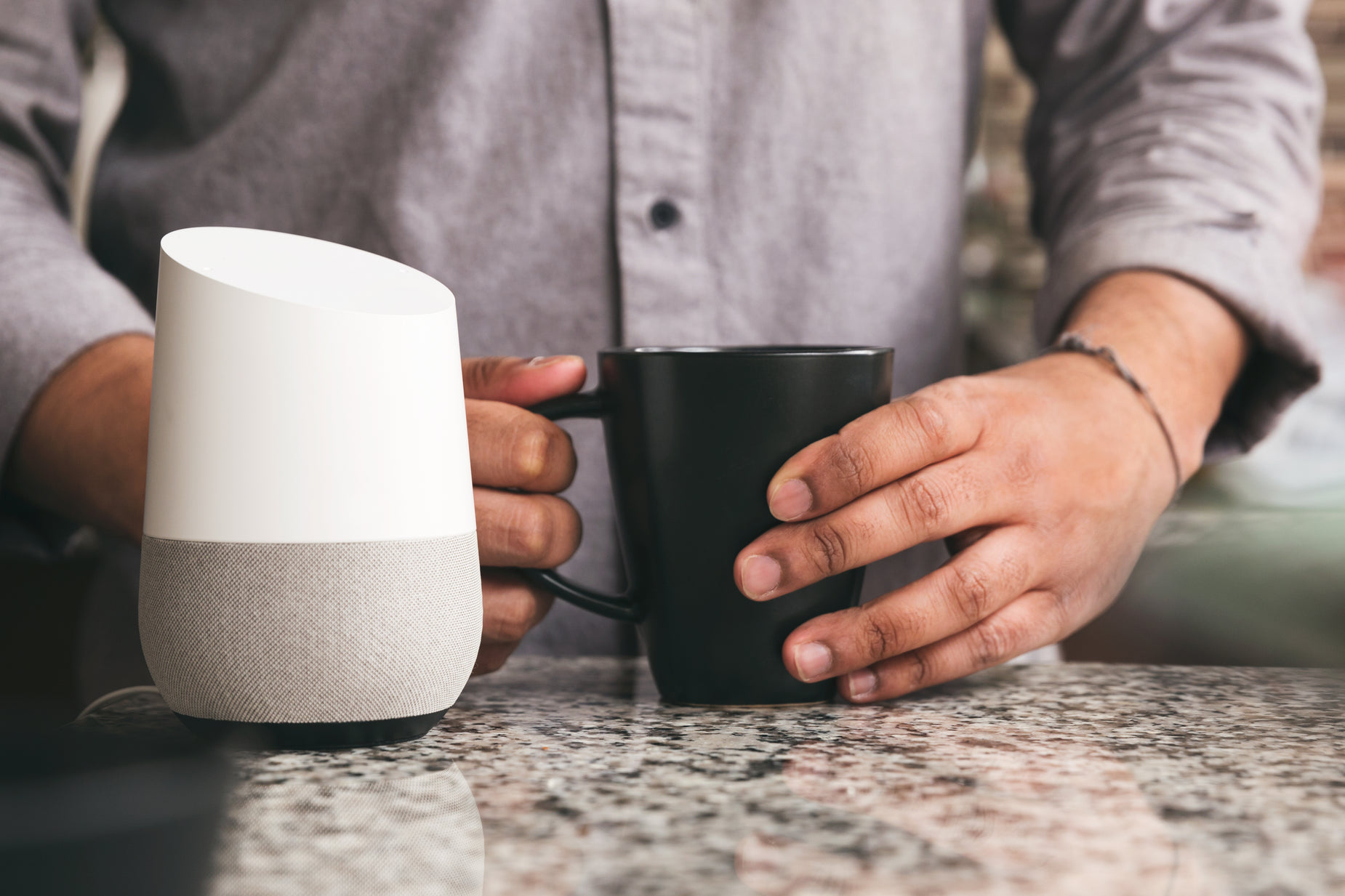 a person holding onto their coffee cup while using an iphone