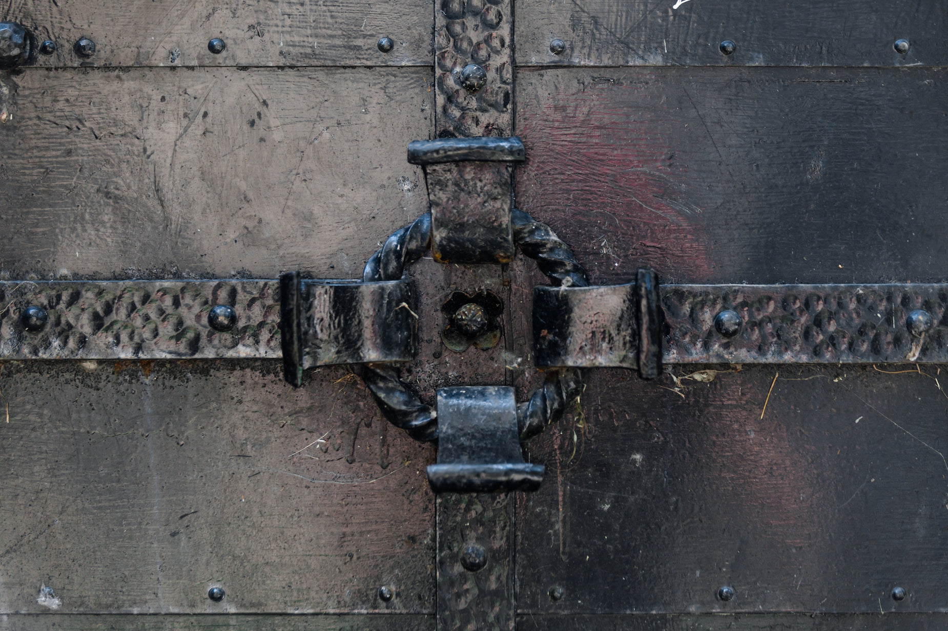 a close up of metal in the center with a riveted design