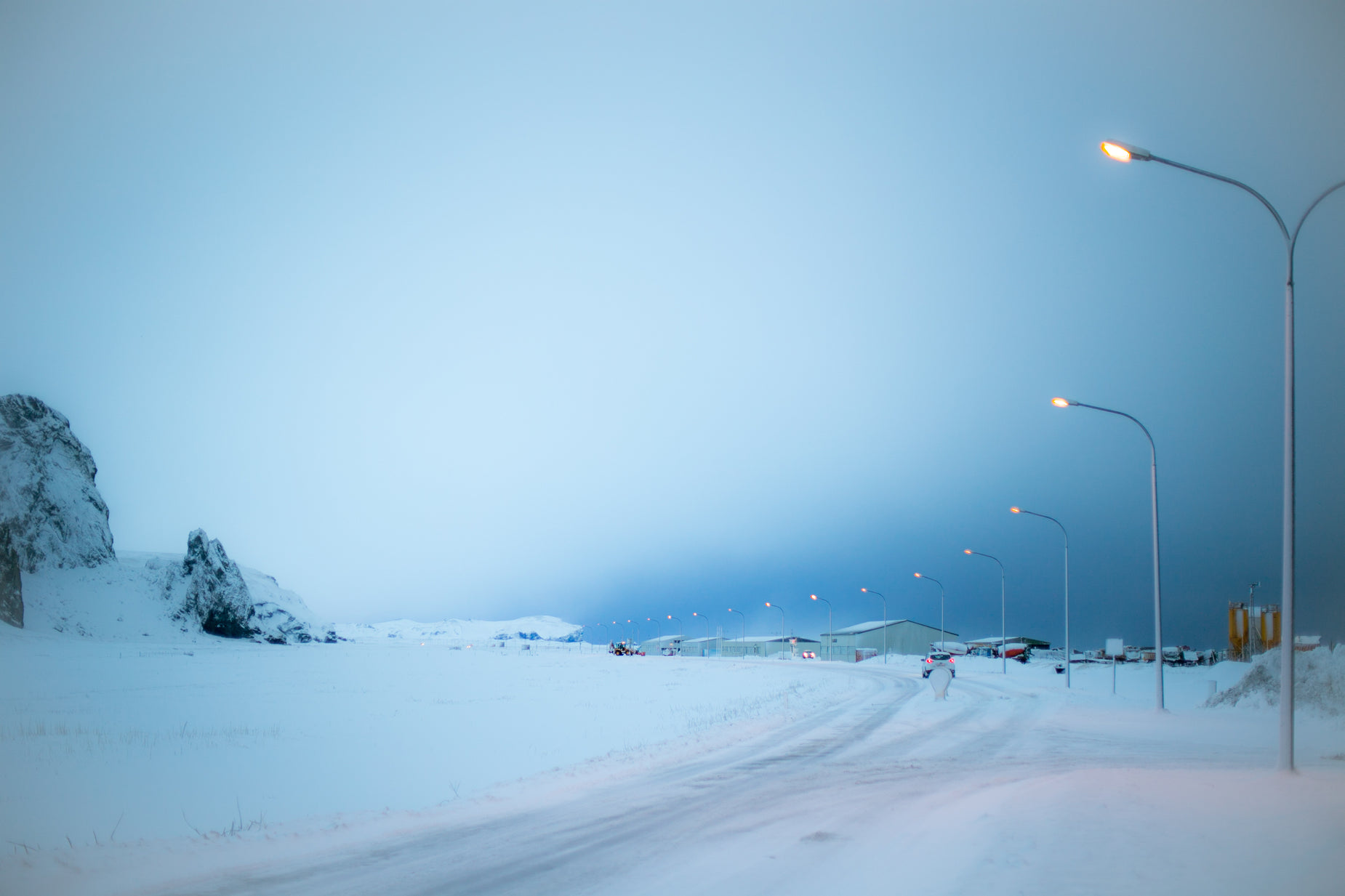 there are many street lights and street signs in the snow