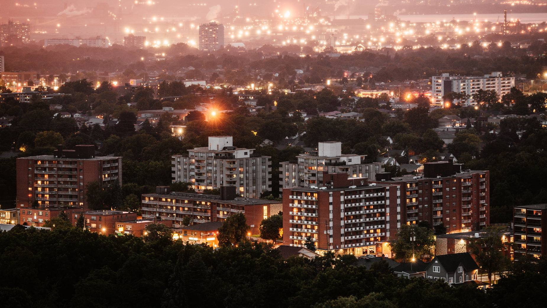 a city at night from above with lights on