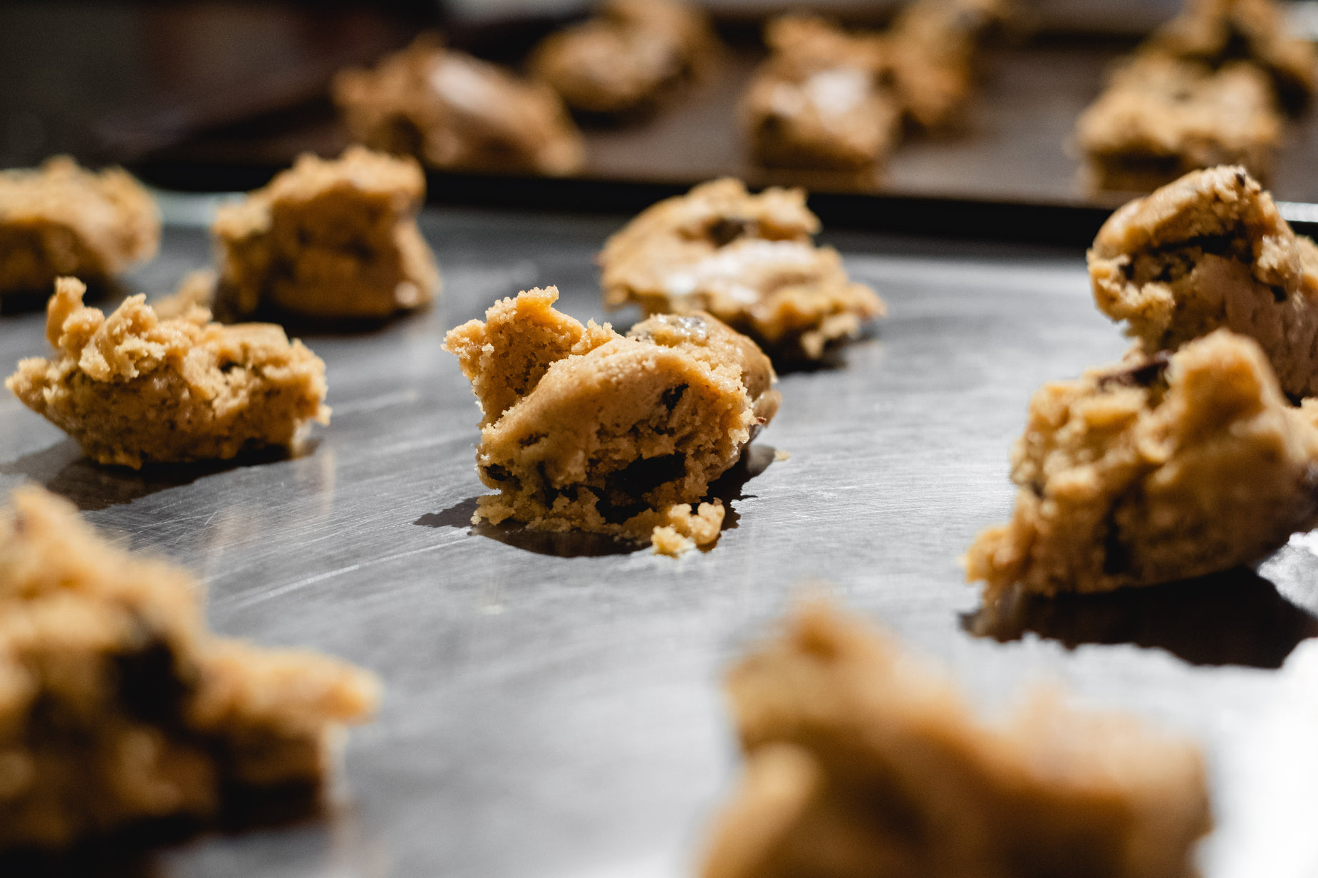 cookies that have been cut in half on a pan