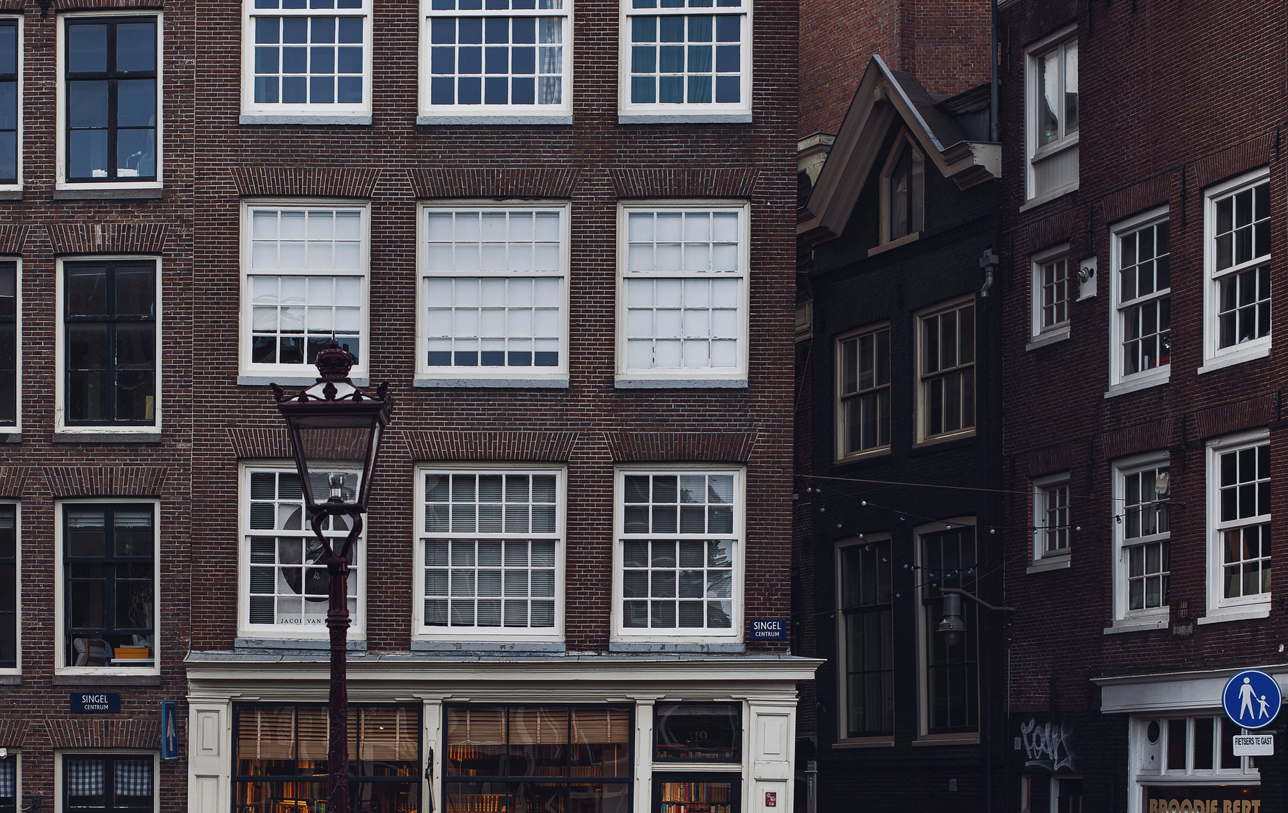 a brown building with three levels in the city