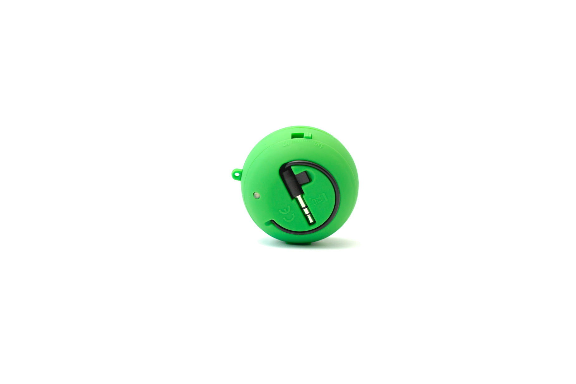 a green plastic pill shaped device with the letter c in it