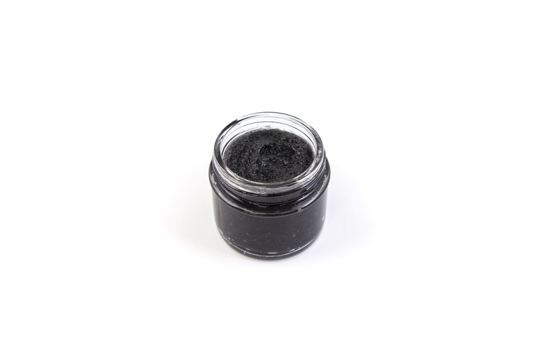 a black jar containing a lot of dirt