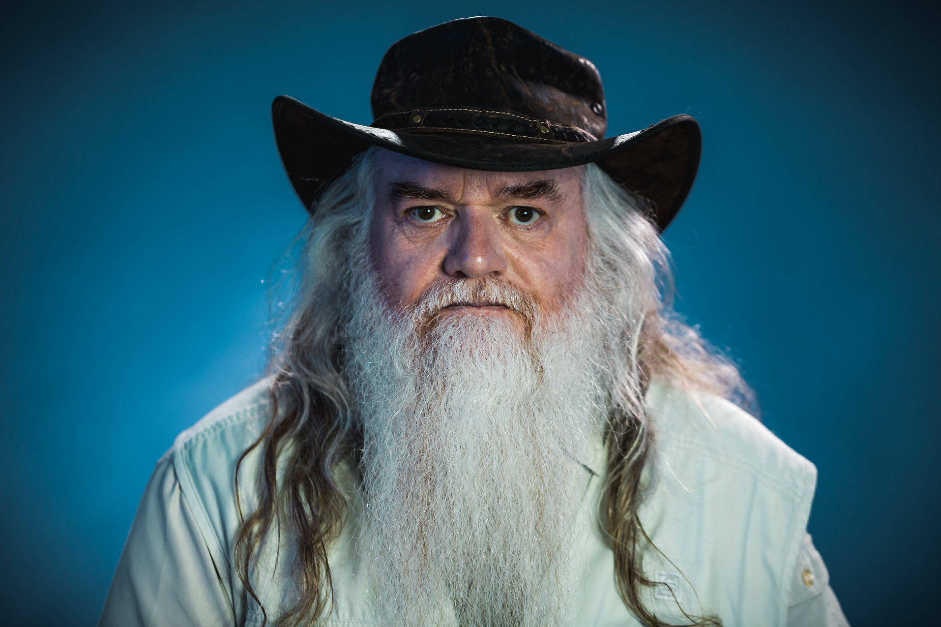 a man with long white hair and a beard