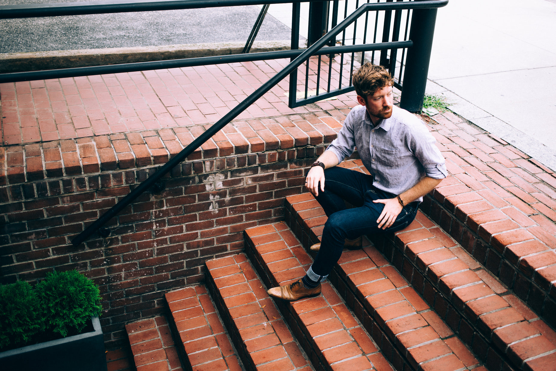 a man sitting on a set of steps