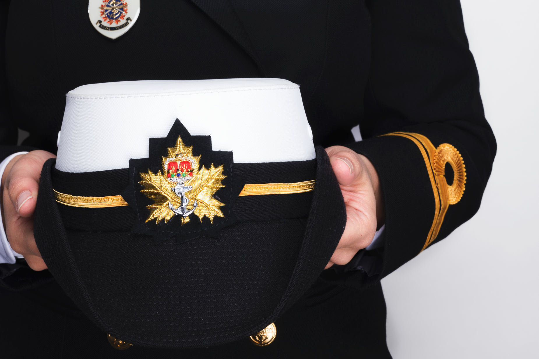 the uniform of a royal canadian service officer is embroidered on