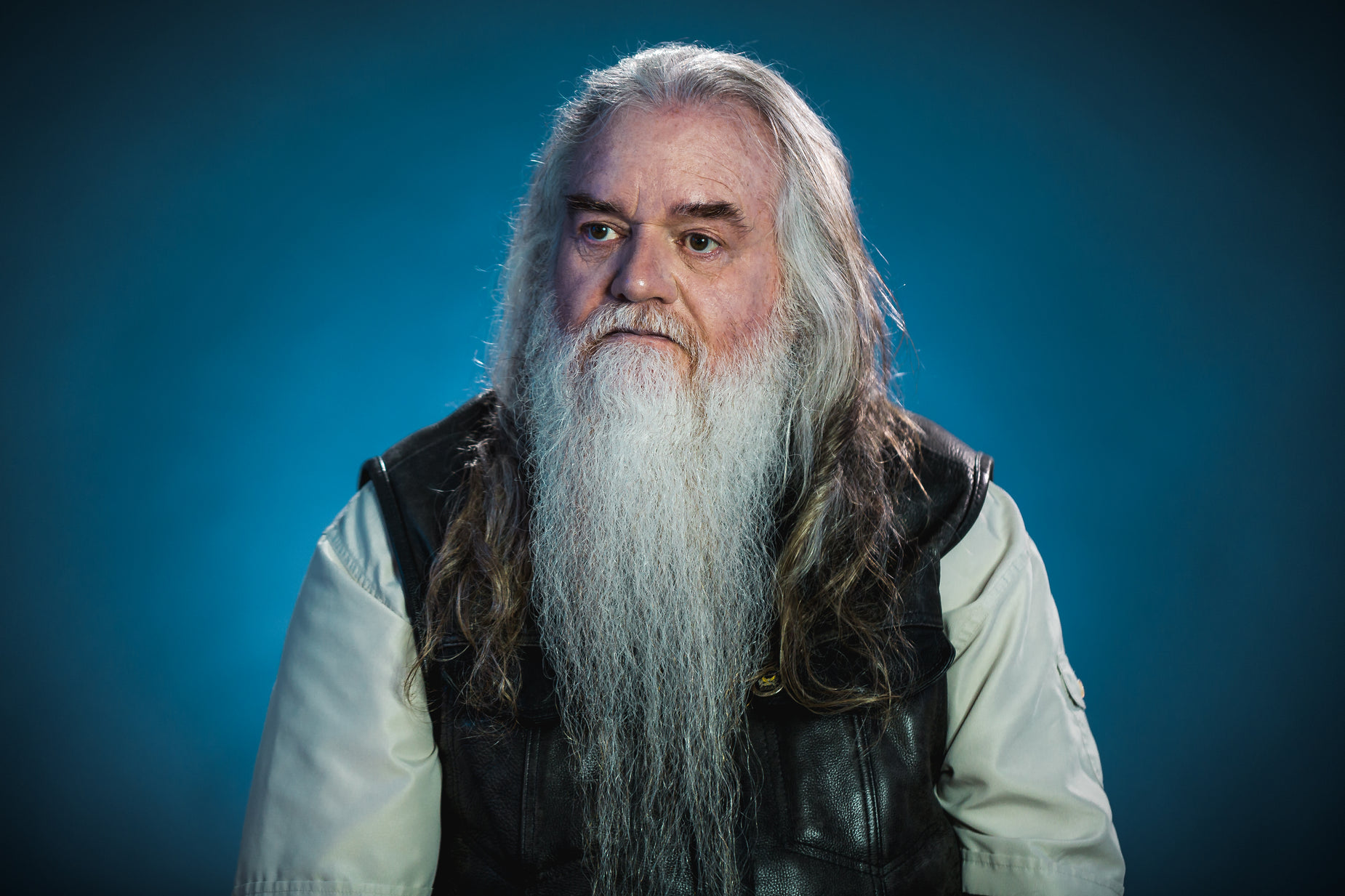 an older man with long hair and a white beard