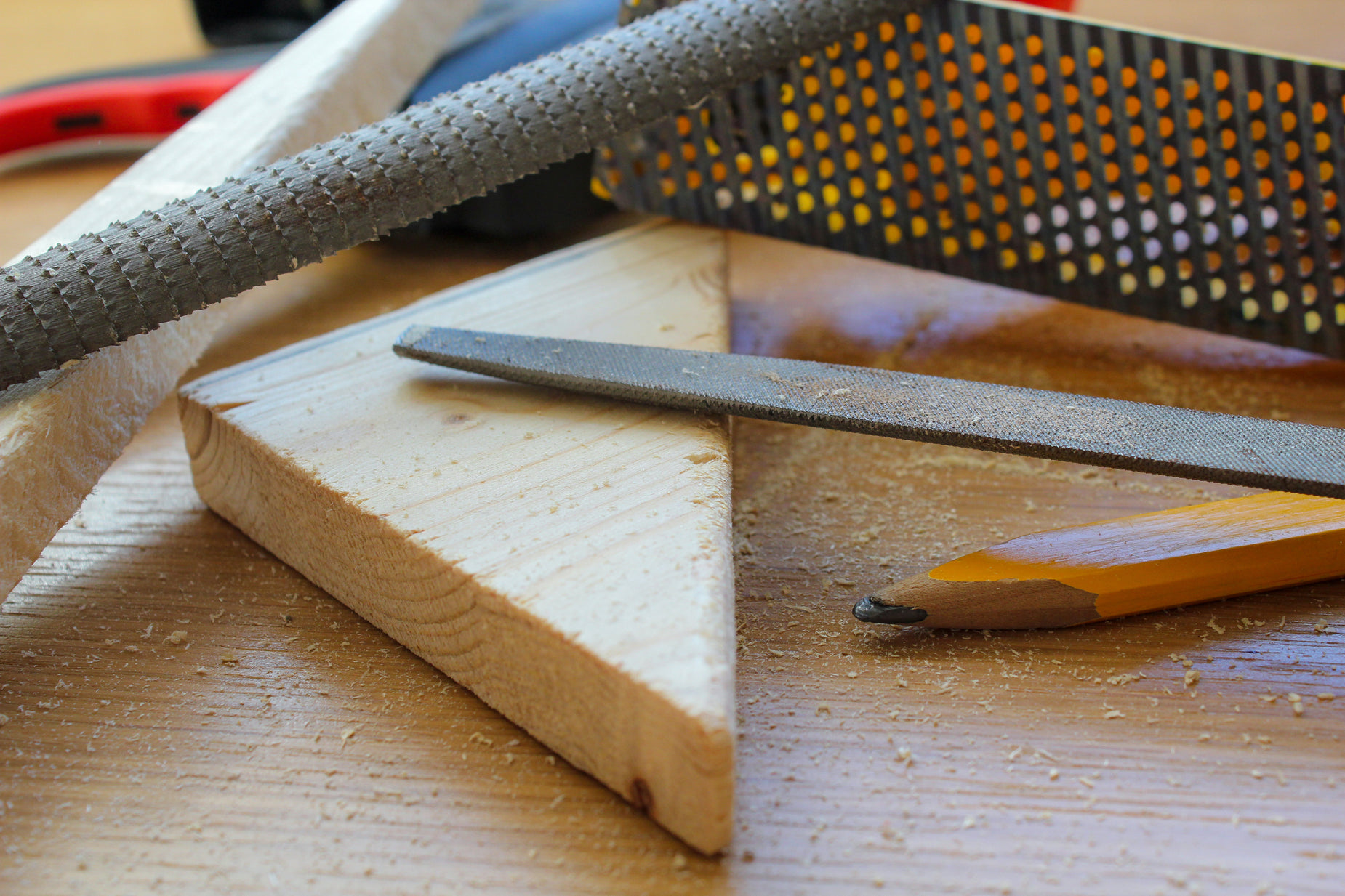 some woodworking supplies are laying on a wooden surface