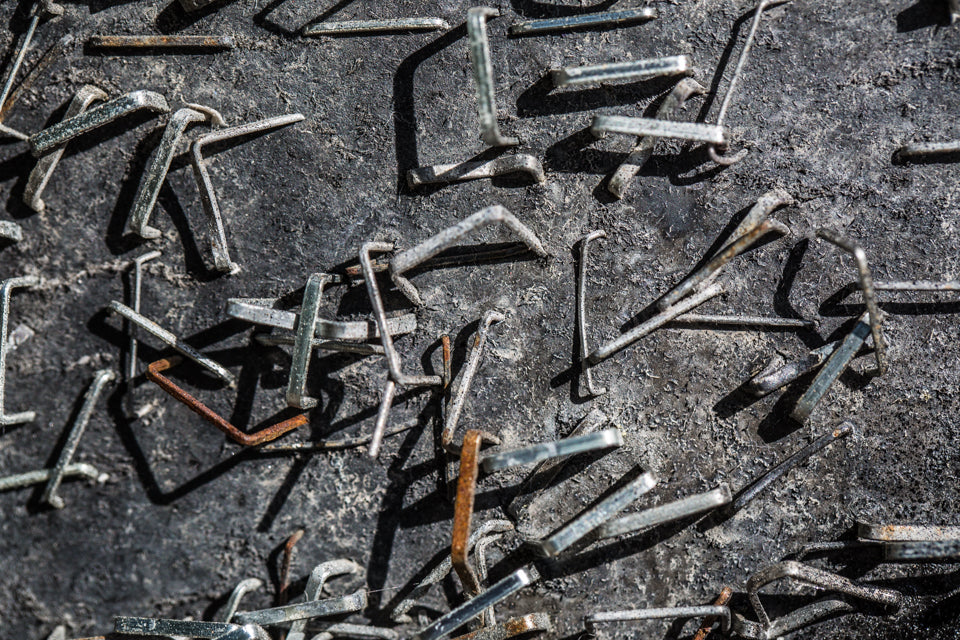 a bunch of nails on top of the ground